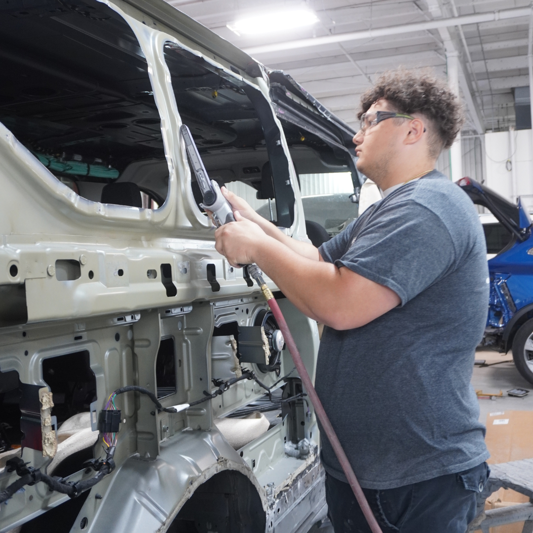 Ethan, Student Employee of the Month, assists with working on vehicles at Reineke Ford Dealership in Lima, Ohio